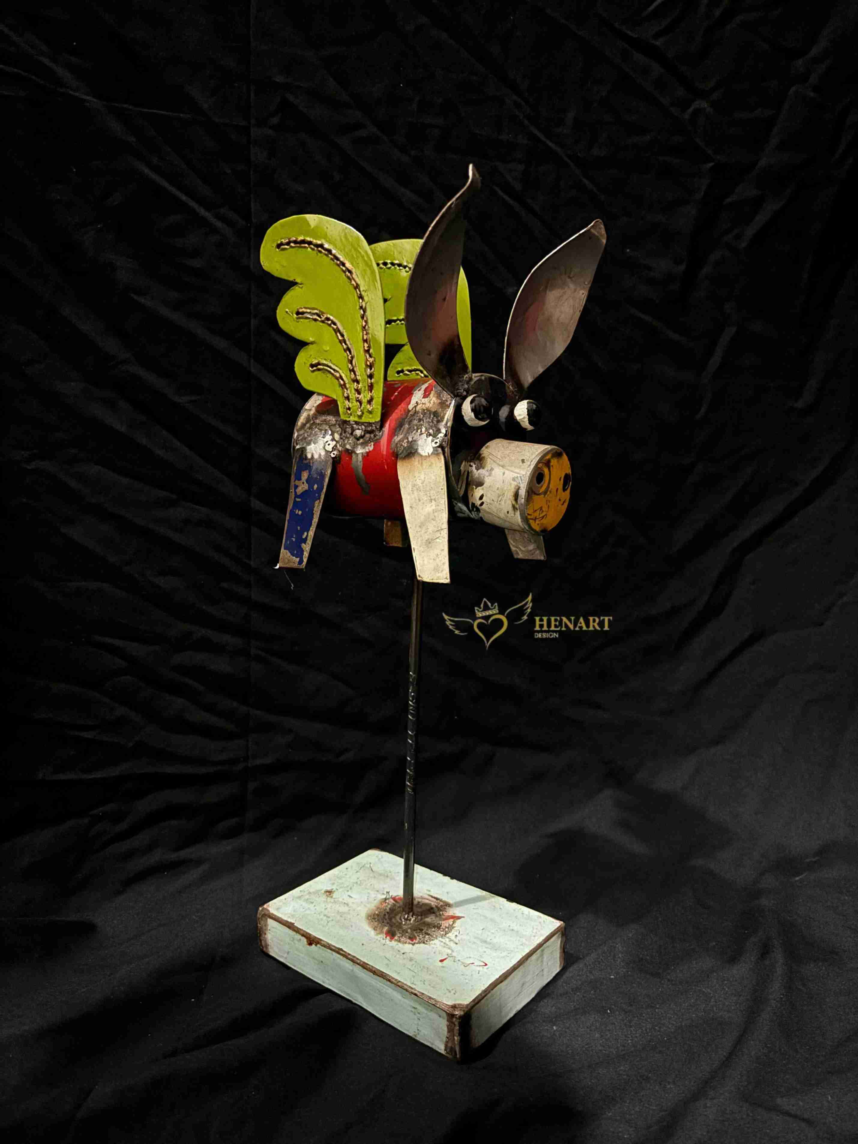 Animal-shaped decoration made from recycled oil drums, mounted on a marble base, a unique creation by Henart.design